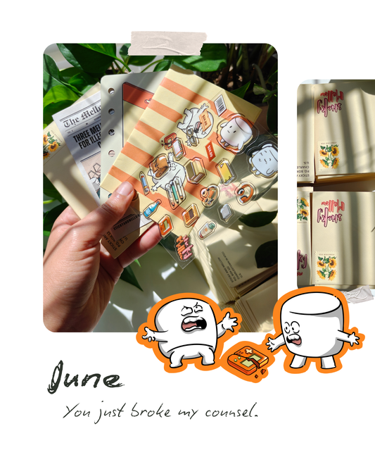Hand holding a small 3D scenery card with stickers sheet, mini news paper,  a striped yellow & orange cover and a yellow envelope, surrounded by green leaves , and below are small marshmallow characters with text under them with 'june' in bold and 'you just broke my console' in normal text .